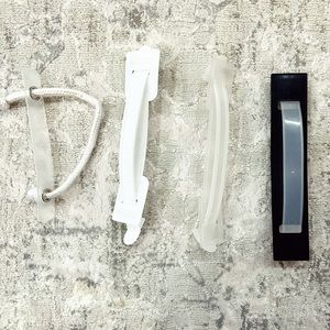 Assortment of 4 plastic travel handles